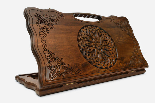 Carved beechwood backgammon board with an ornate rosette medallion and a carry handle, propped open