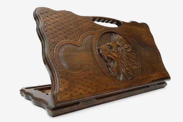Carved beechwood backgammon board with a roaring lion medallion and a carry handle, propped open
