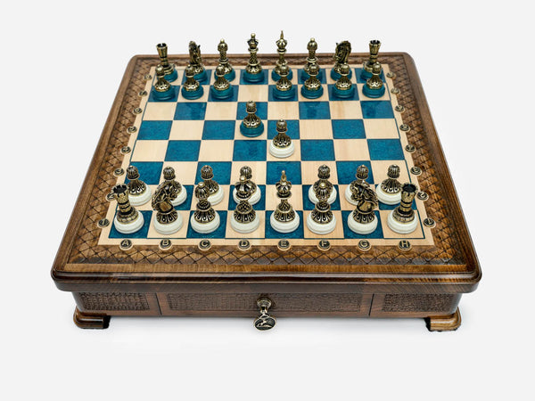 Handle Blue Epoxy chess set with bronze pieces set up for play, front view