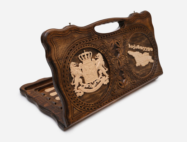 Carved beechwood backgammon board with the Georgian coat of arms and map, with a carry handle, propped open