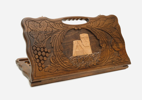 Carved beechwood backgammon board with the We Are Our Mountains monument of Artsakh and a carry handle, shown propped open