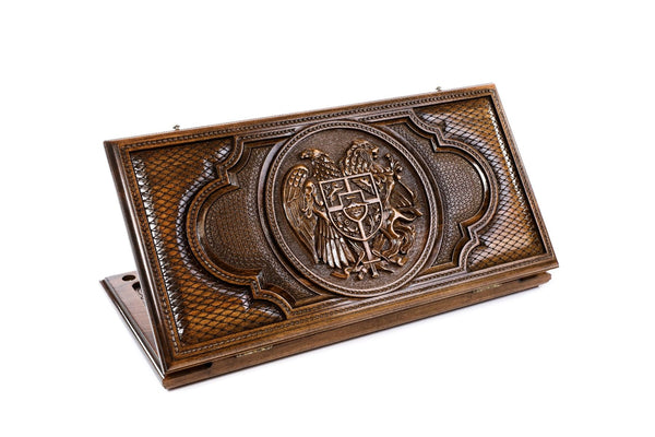 A frontal shot of the closed Armenian Coat of Arms classic backgammon board showing the detailed eagle and lion relief carving.