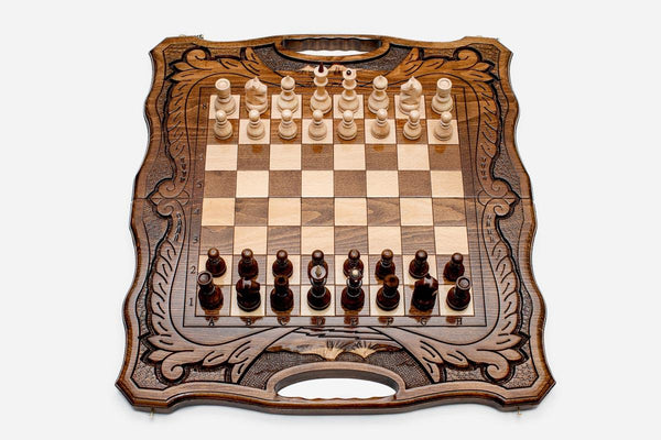 Folding walnut chess board with a Mount Ararat inlay, carved corners and beech and walnut pieces in starting position