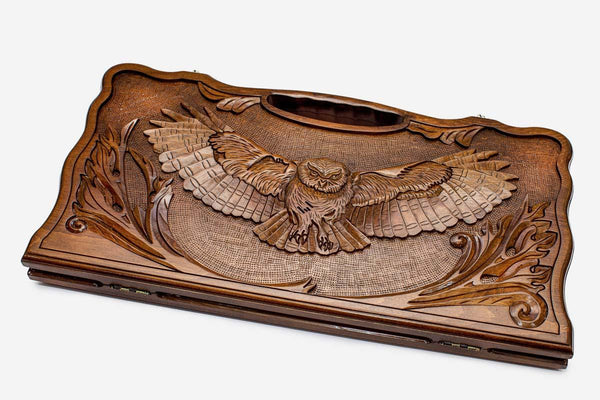 Carved beechwood backgammon board with an owl medallion and a carry handle, propped open