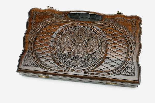Compact carved beechwood backgammon board with the Russian coat of arms and a carry handle, propped open