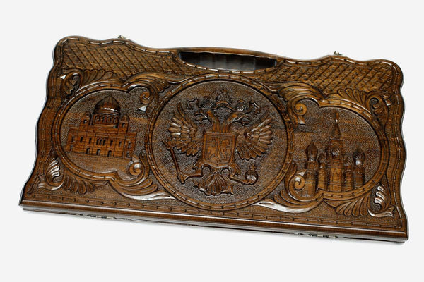 Carved beechwood backgammon board with three Russian landmark medallions and a carry handle, propped open