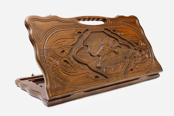 Carved beechwood backgammon board with a regal lion medallion and a carry handle, propped open