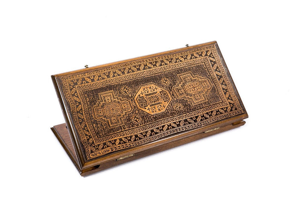 A frontal shot of the closed Lori Carpet classic backgammon board showing the detailed geometric rug relief carving.