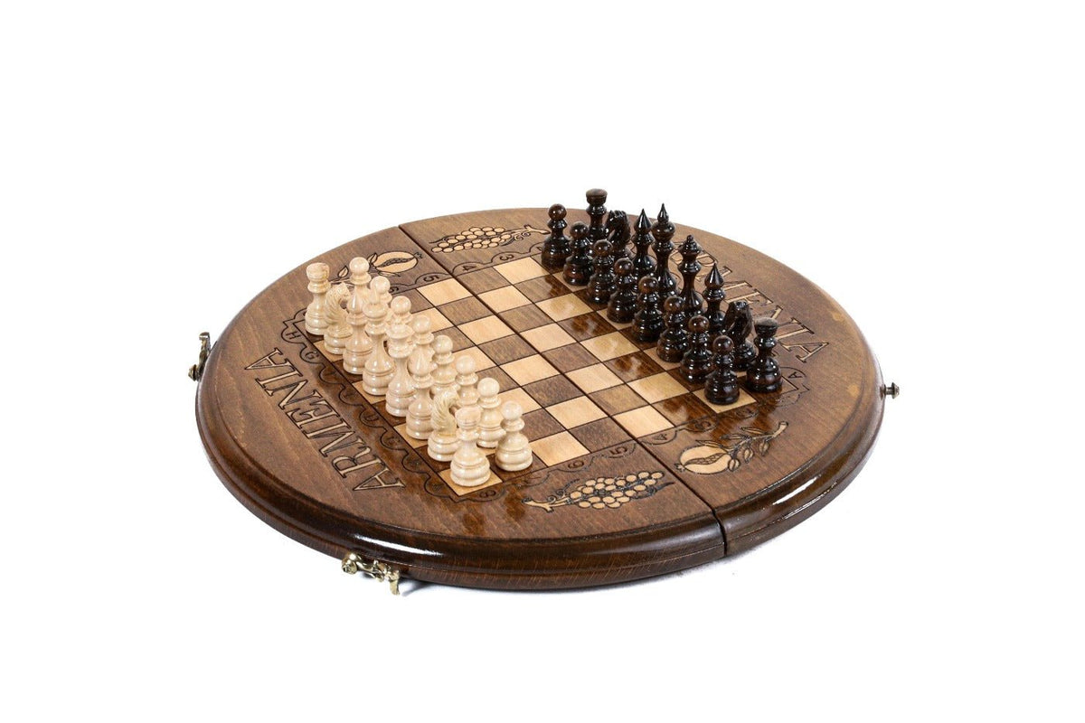 Round wooden chess board with Armenia's name carved along the rim