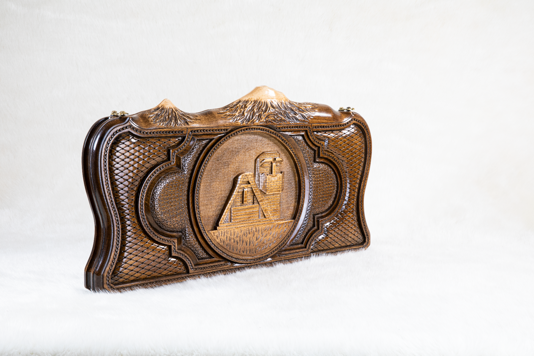 The interior of the open Hrachya Ohanyan Garni set showing the rich wood grain and the professional-grade playing surface.