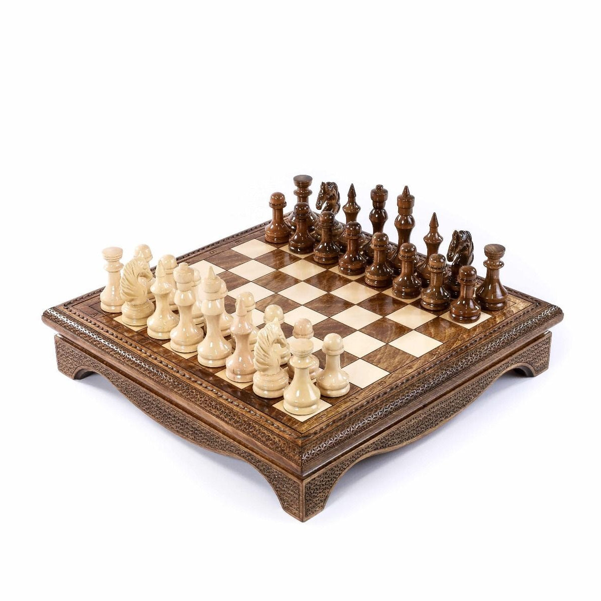 Wooden chess set with carved pieces on a storage board