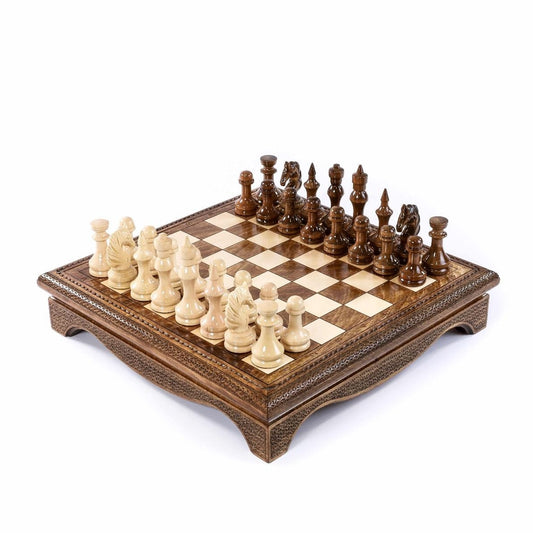 Wooden chess set with carved pieces on a storage board