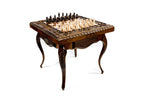 Carved cabriole legs of the chess-backgammon table
