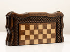 Wooden chess set folded showing the carved cover