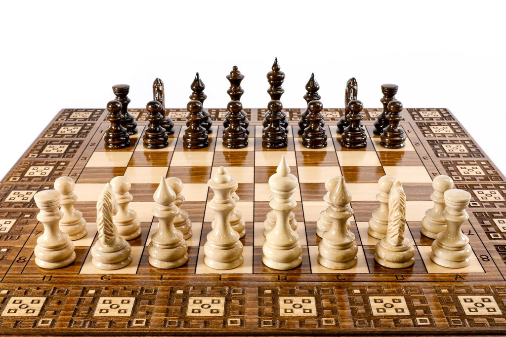 Close-up of the detailed carpet motif carvings and solid wood finish on this 2-in-1 classic board.