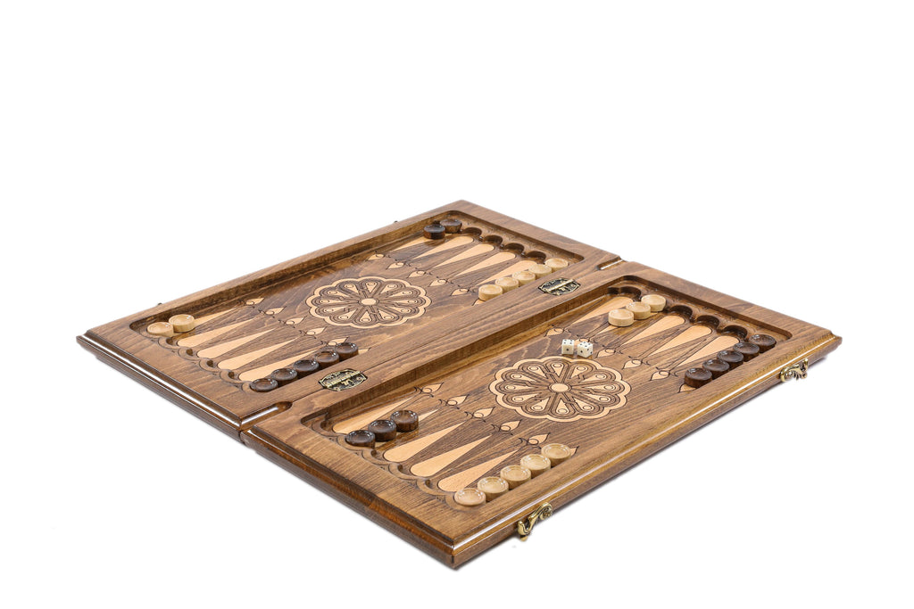 Medium backgammon set open with light and dark checkers and dice on the 50 cm board, angled view