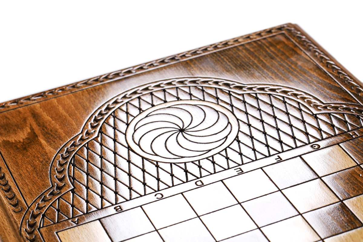 Eternity whirl carved in the lattice cartouche beside the chequerboard on the back cover