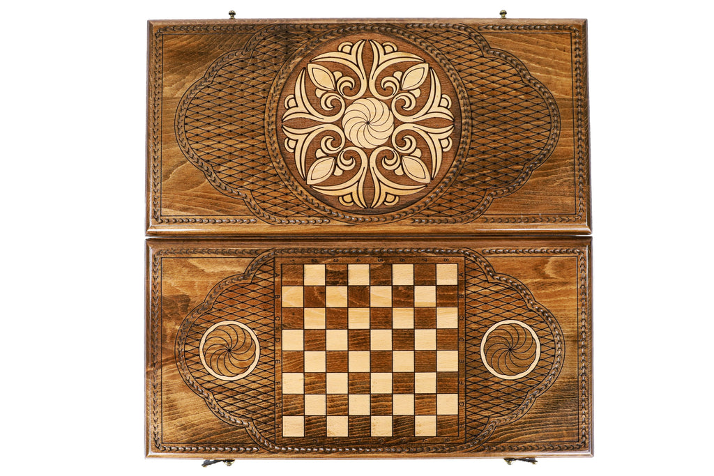Front cover with the leaf ornament above the back cover with the chequerboard, seen from above