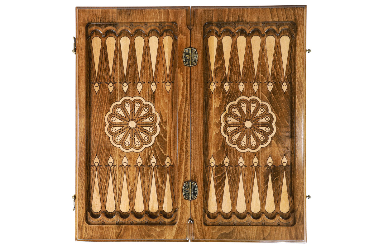 Open medium backgammon board from above: dark field, pale points, wheel ornament on each half