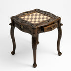 Gold eagle medallion on the carved chess table apron