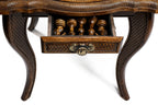 Hand-carved chess pieces on the contour-outline board