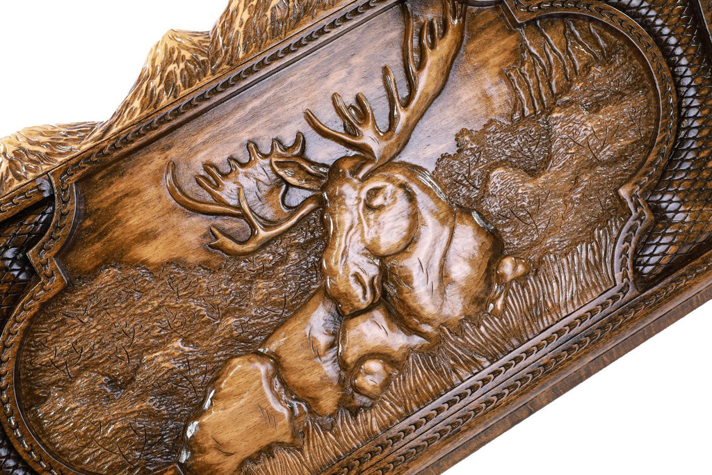 A close-up of the mountain peak edges and animal relief, showcasing the precision of the solid wood craftsmanship.