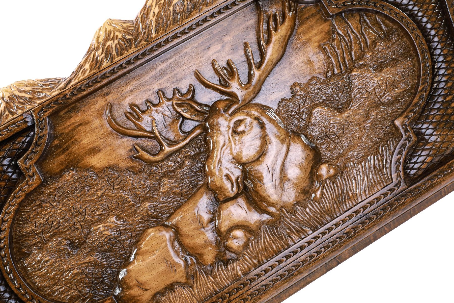 A close-up of the mountain peak edges and animal relief, showcasing the precision of the solid wood craftsmanship.