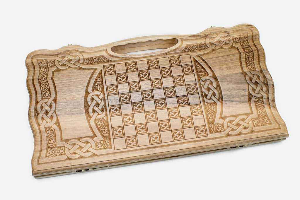Angled view of the Celtic knotwork carved backgammon board