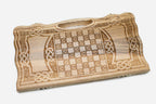 Angled view of the Celtic knotwork carved backgammon board