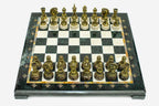 Green and cream marble chess set with hand-cast bronze pieces arranged for play and brass coordinate medallions