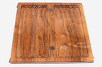 A carved rosette at the corner of the board