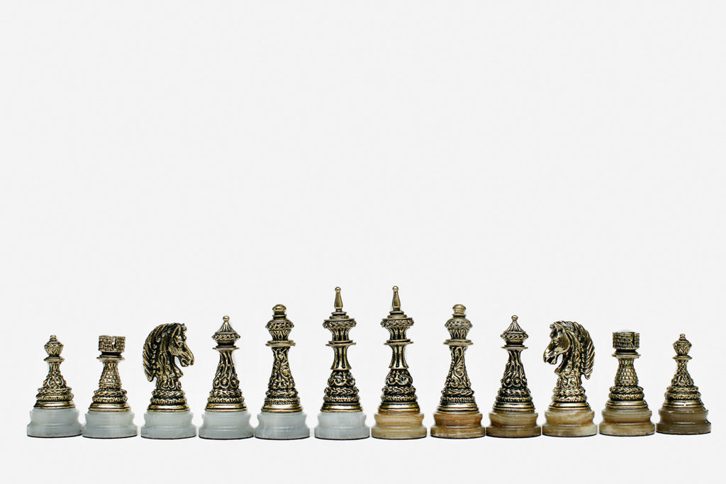 Golden marble chess board framed in warm veined stone