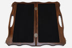 The opened board showing its felt-lined interior compartments and metal clasps