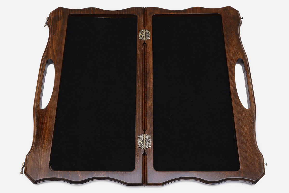The opened board showing its felt-lined interior compartments and metal clasps