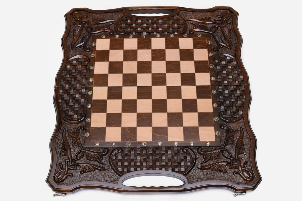 Angled view of the carved folding chess set with its wooden pieces