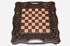 Angled view of the carved folding chess set with its wooden pieces