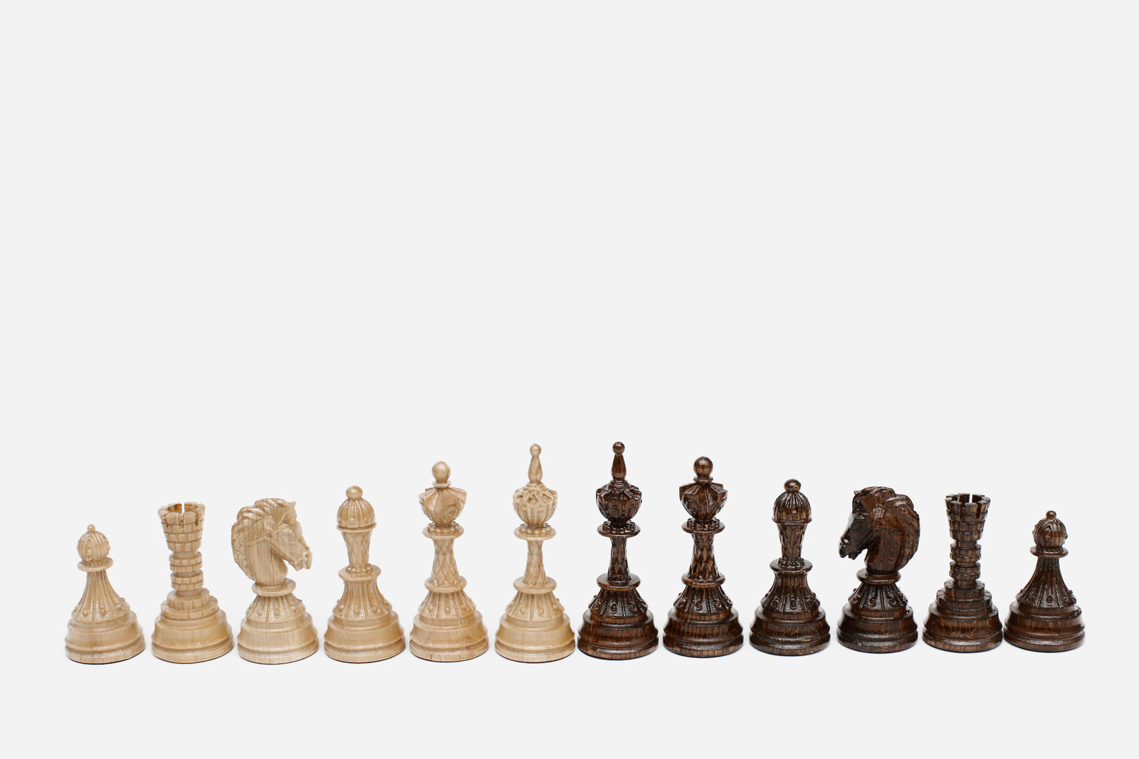 Overhead view of the opened board with the full set of beech and walnut pieces in starting position