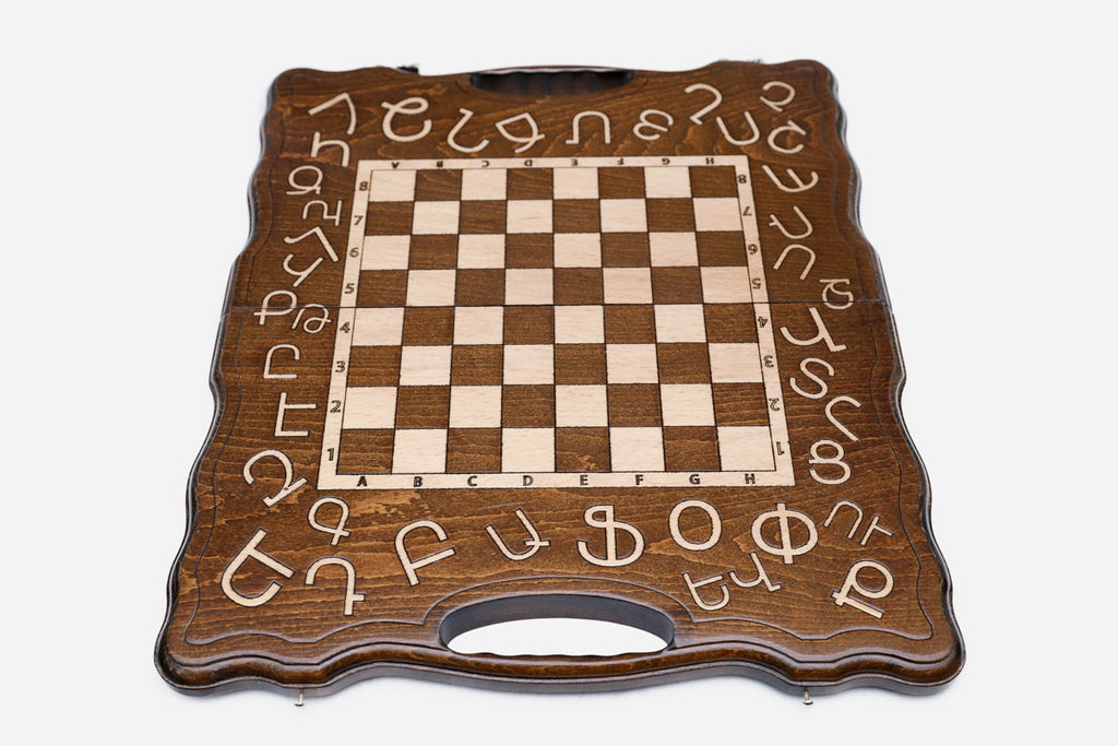 Alphabet chess set shown folded with carry handle