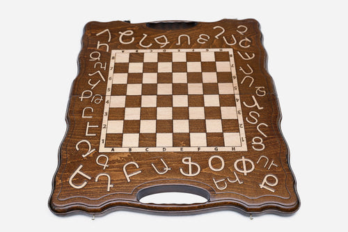 Alphabet chess set shown folded with carry handle