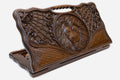 Carved beechwood backgammon board with a lion medallion and spider webs, with a carry handle, propped open