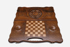 Angled view of the floral medallion carved backgammon board