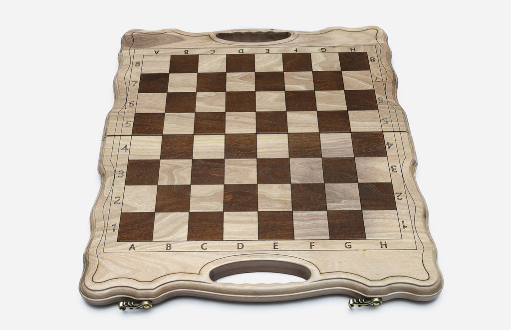 Overhead view of the chessboard with the full set of bronze pieces