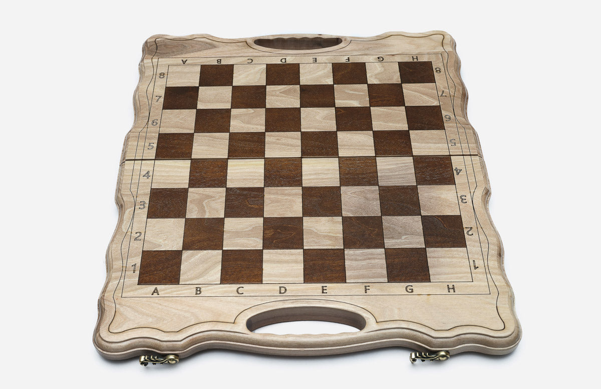 Overhead view of the chessboard with the full set of bronze pieces