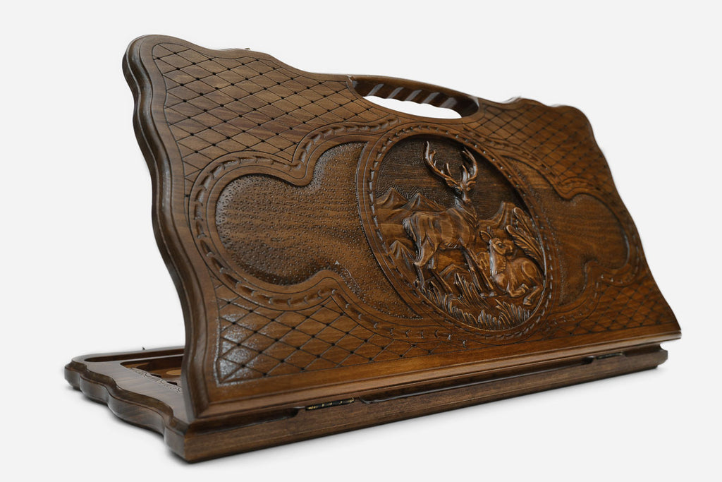 Carved beechwood backgammon board with a deer medallion and a carry handle, propped open