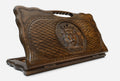 Carved beechwood backgammon board with a crowned lion medallion and a carry handle, propped open