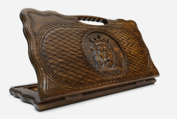 Carved beechwood backgammon board with a crowned lion medallion and a carry handle, propped open