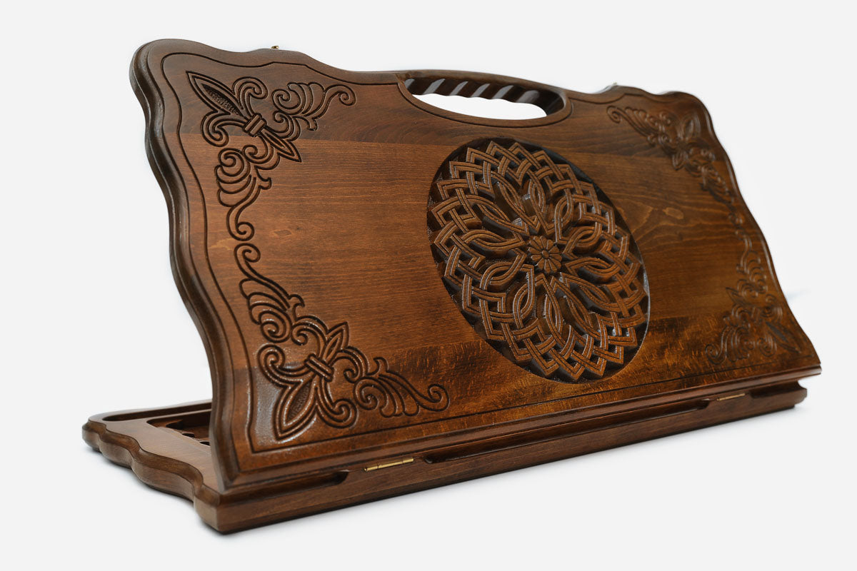 Carved beechwood backgammon board with an ornate rosette medallion and a carry handle, propped open