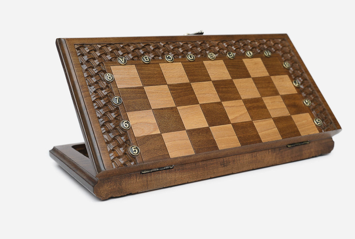 Close-up of a lattice design carving on the walnut board