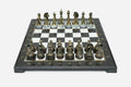 Black marble chess set with hand-cast bronze pieces arranged for play and brass coordinate medallions