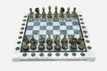Grey and white marble chess set with hand-cast bronze pieces arranged for play and brass coordinate medallions